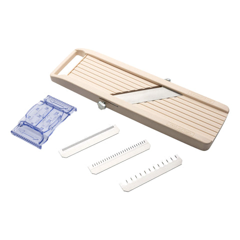 Benriner mandoline body and blades for precise cuts.