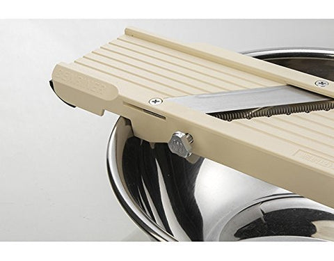 Ledge catches slices for easy transfer with Benriner No. 64.