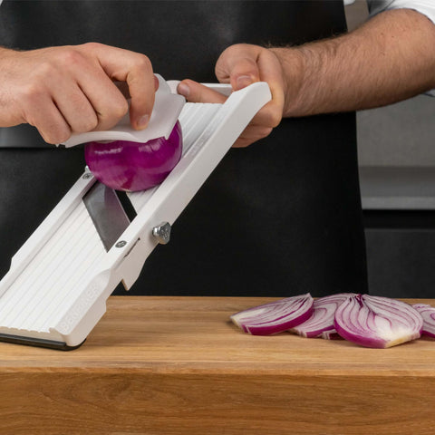 Benriner safety guard protects fingers during slicing