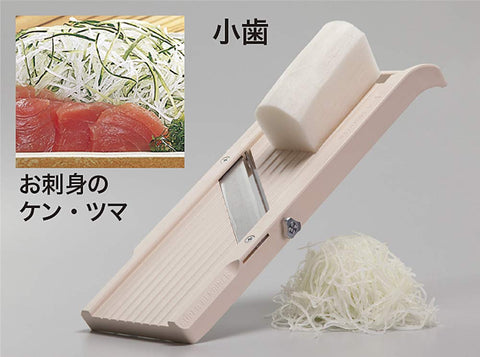Close-up of blades on Benriner slicer for uniform vegetable cuts