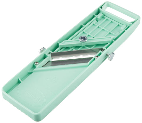 Benriner Vegetable Slicer Green blade close-up emphasizes sharpness for clean slices.
