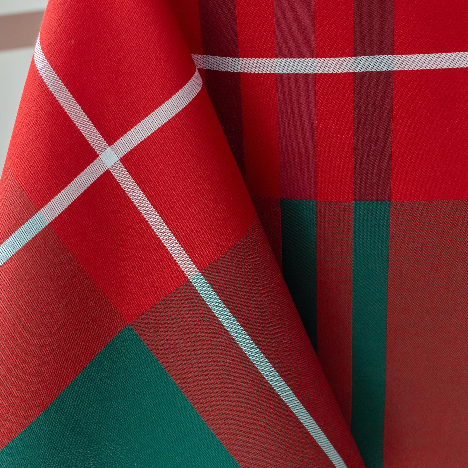 Holiday dining scene with Bristol plaid tablecloth complements white dinnerware