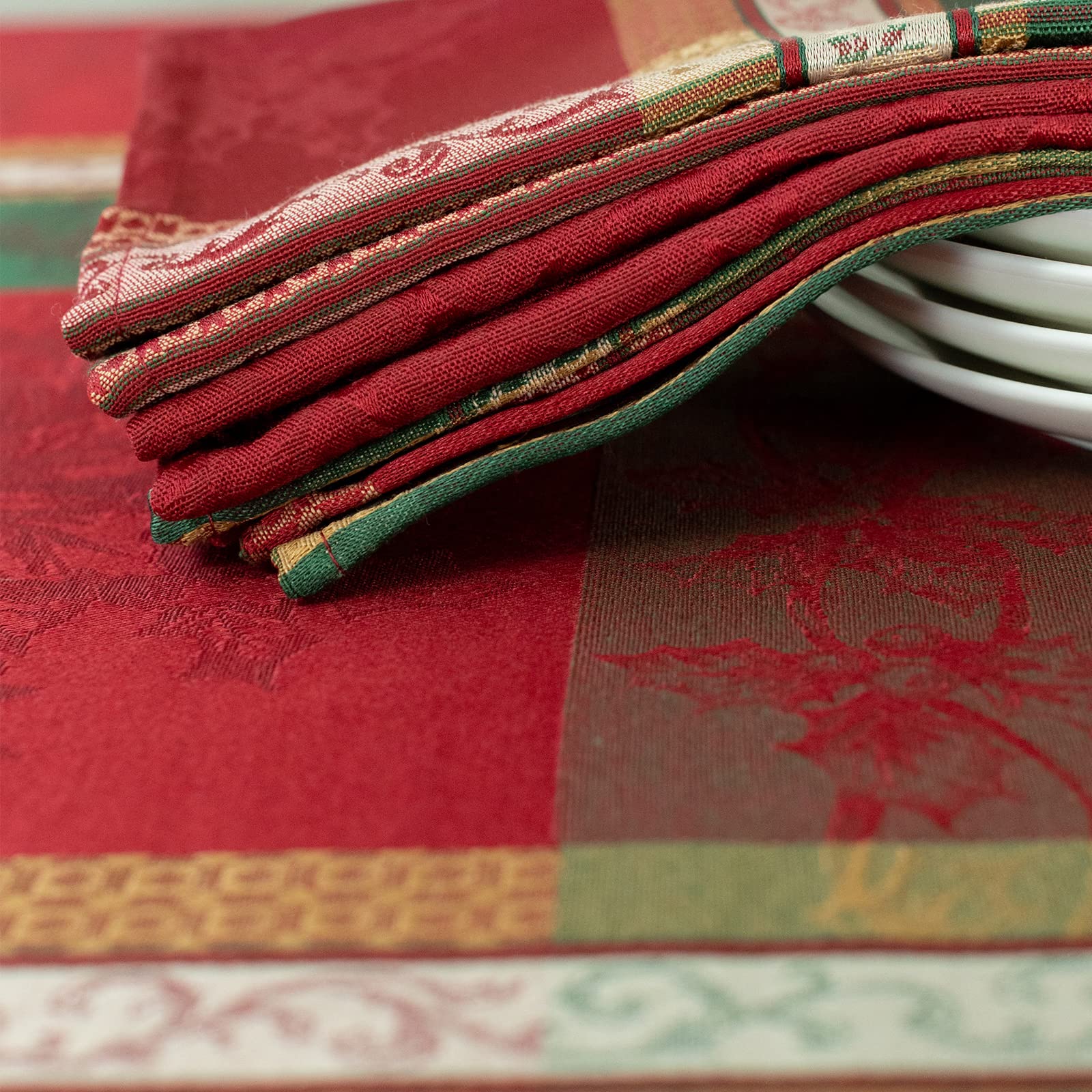 Benson Mills Holiday Legacy napkins paired with coordinating linens in a seasonal tablescape.