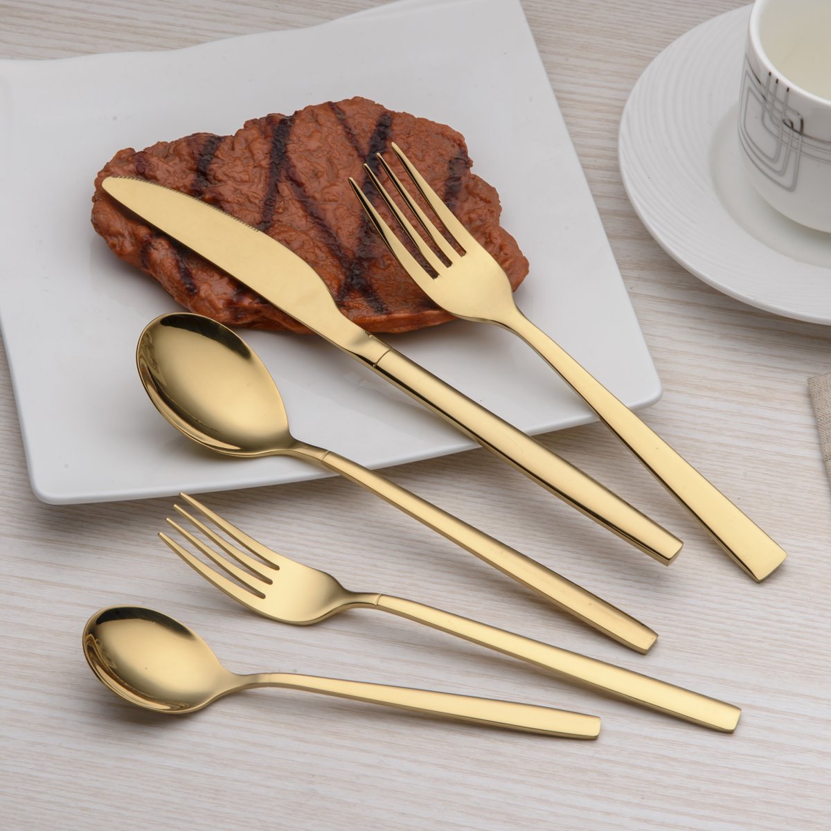 Berglander gold flatware dinner forks close-up, elegant shine for entertaining