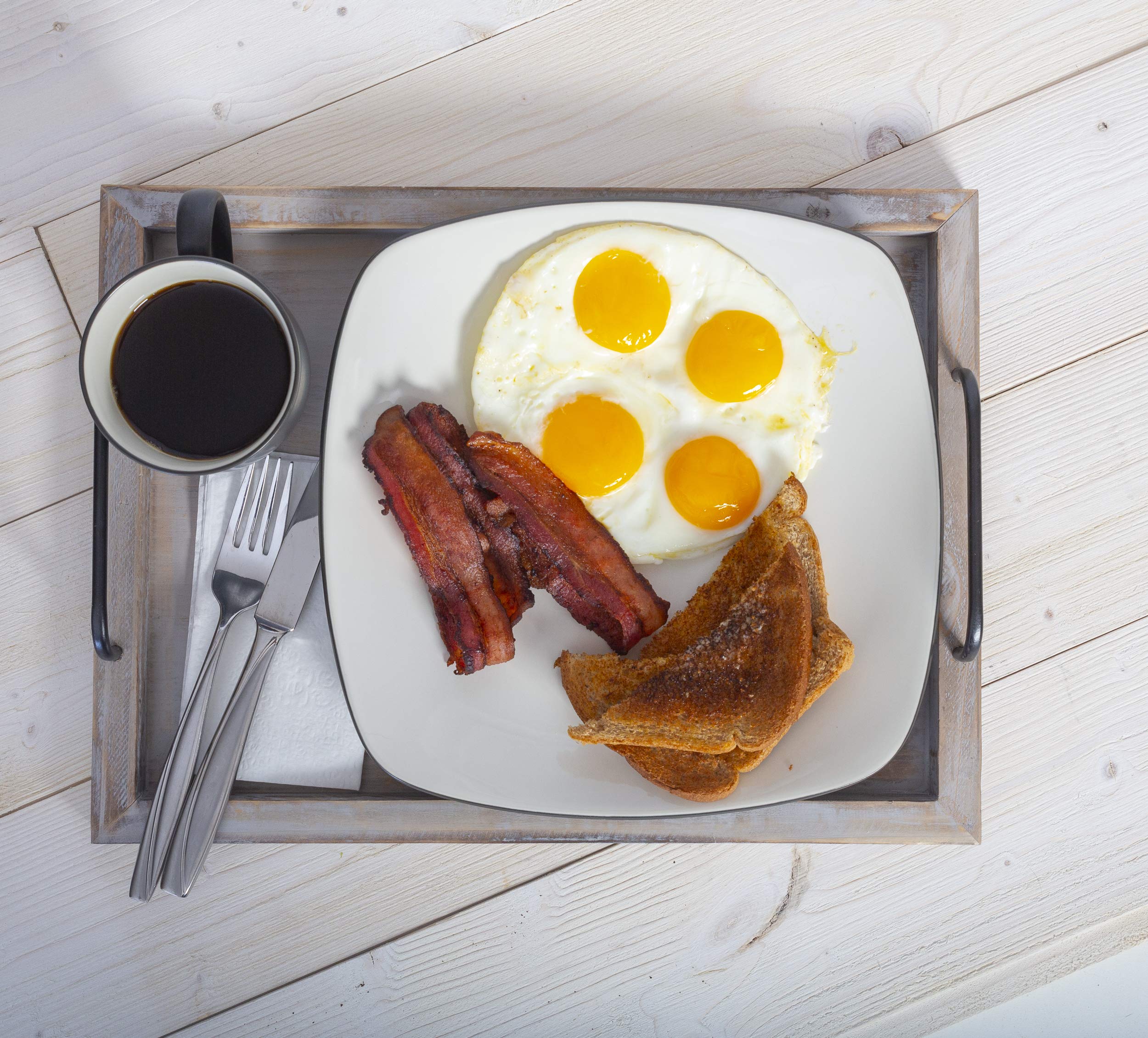 Besti metal handles close-up on trays, sturdy grip for carrying drinks.