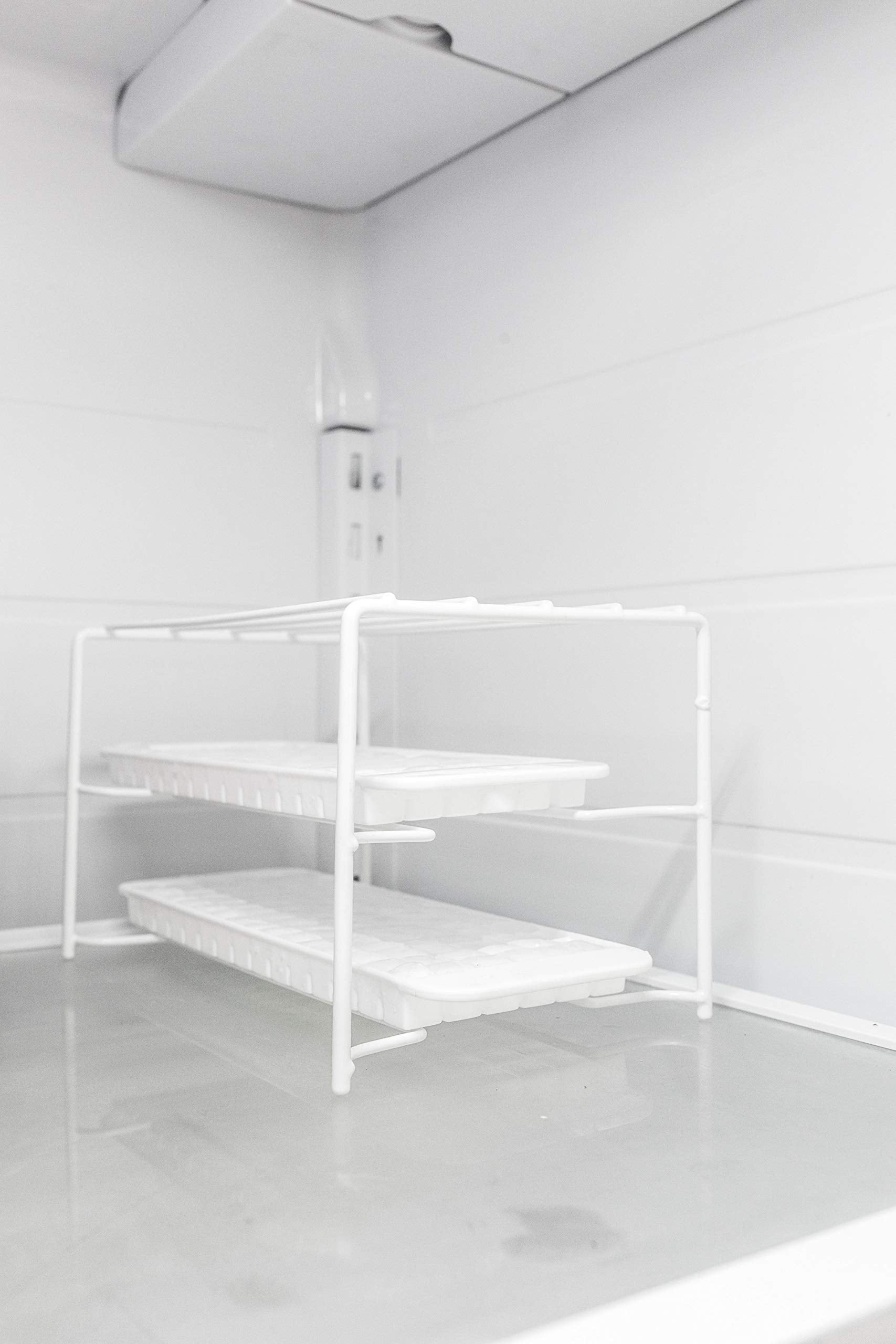 Better Houseware stackable freezer shelf elevates trays for easy retrieval.