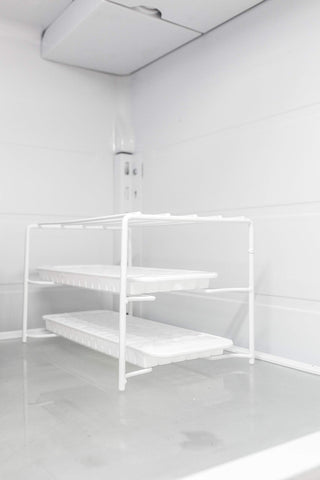 Better Houseware stackable freezer shelf elevates trays for easy retrieval.