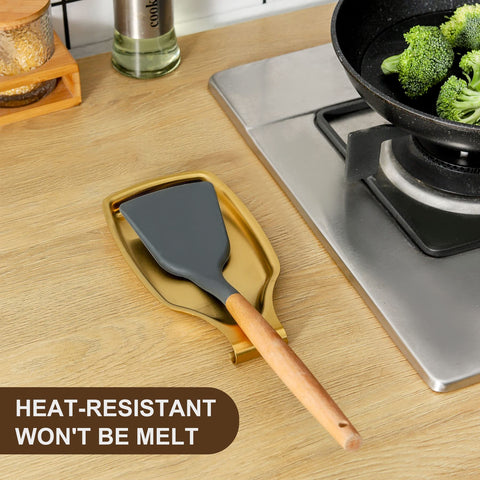 BETTWILL gold spoon rest protects counters while cooking on the stove.