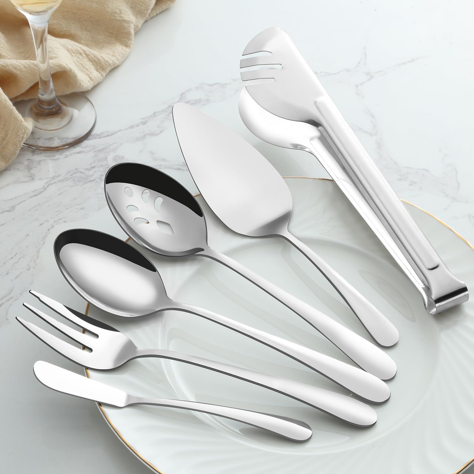 BEWOS slotted spoons draining liquids from dishes