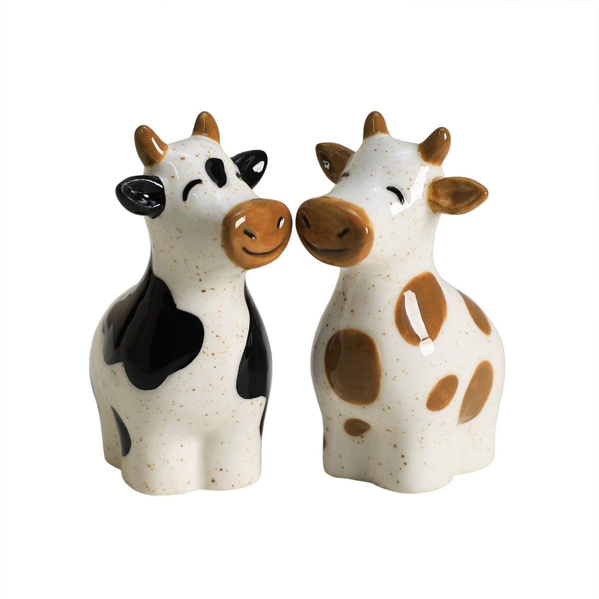 Bicuzat cow salt shaker, hand-painted ceramic, adds playful charm to table settings.