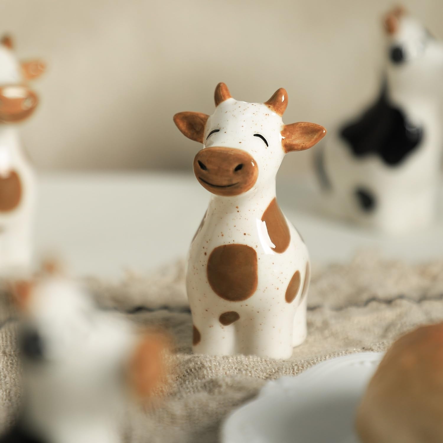 Bicuzat handmade style cow salt pepper shakers for playful table accents.