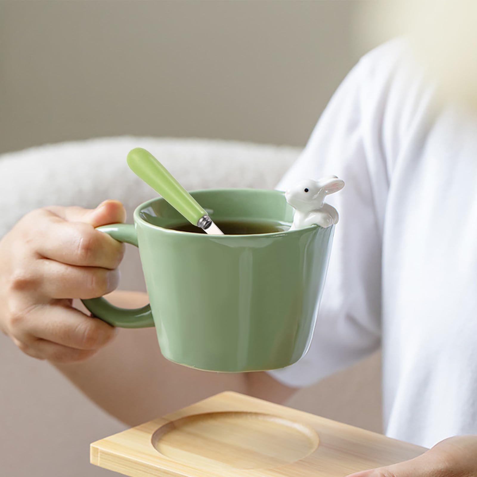 BigNoseDeer mug with lid and spoon in green, ideal for hot beverages at home