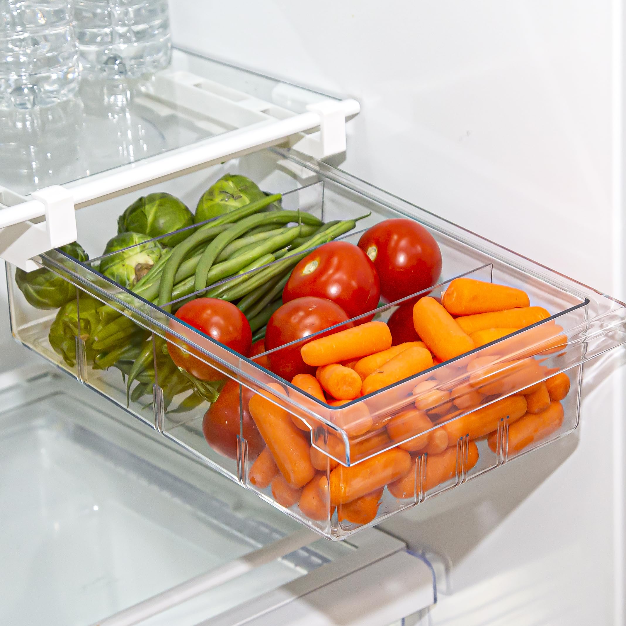 BINO pull-out fridge organizer in clear bins for easy food visibility.