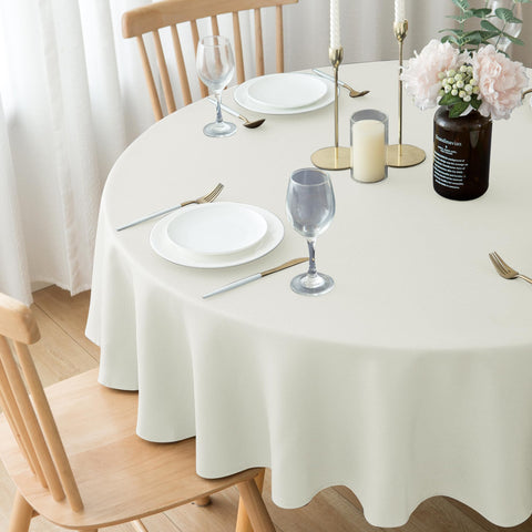 Biscaynebay ivory round tablecloth demonstrates machine-washable convenience.