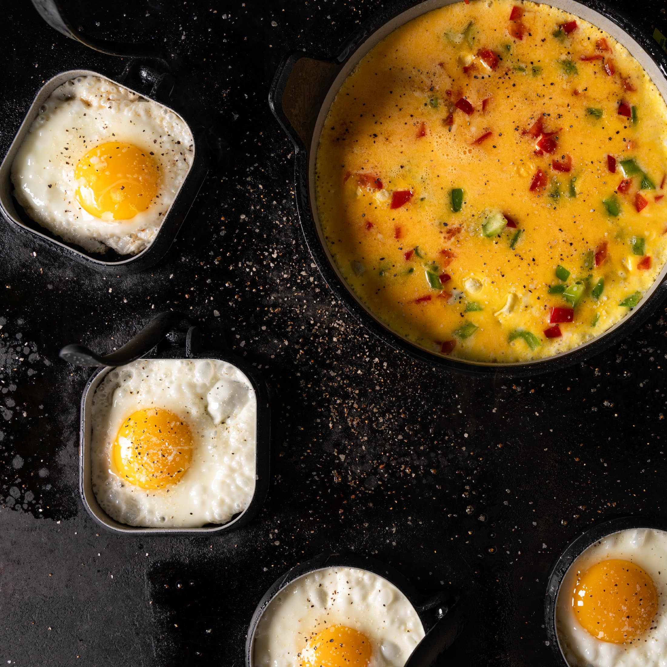 Blackstone egg rings on the griddle help cook eggs evenly for sandwiches.