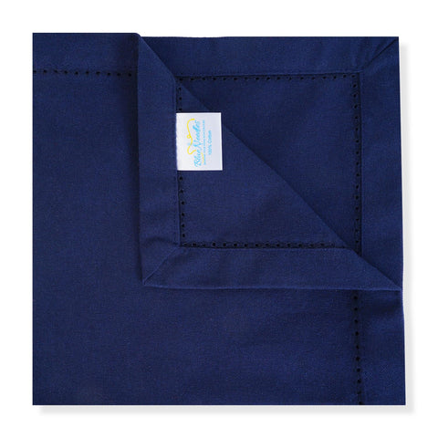 Blue Needles navy napkins folded neatly enhance tablescape and decor.