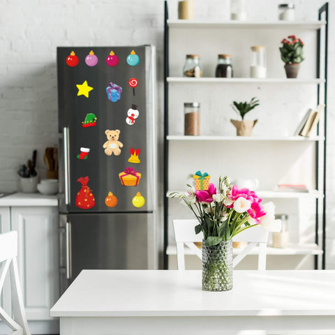 Blulu Christmas magnets holding receipts and artwork on fridge