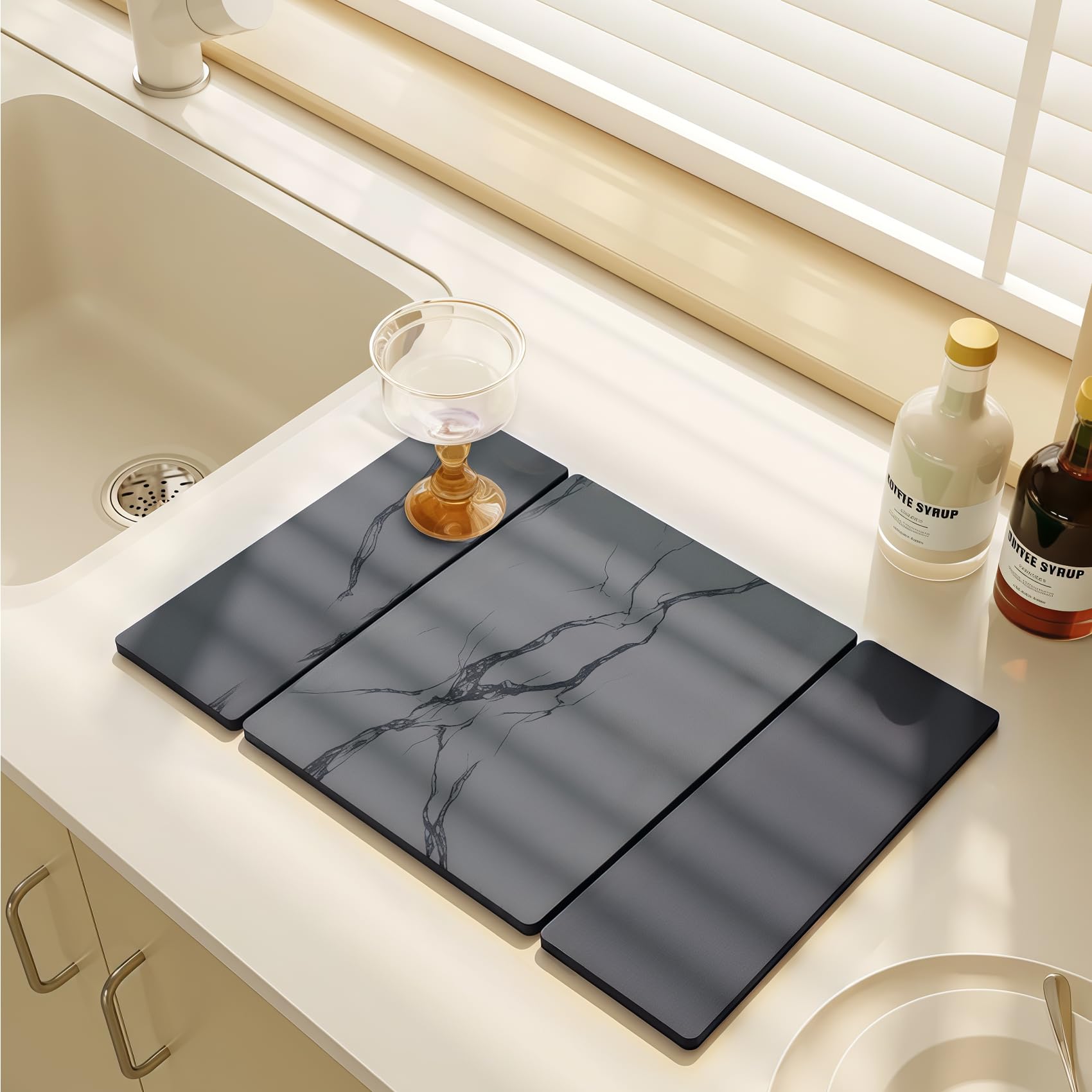 BOMOKS collapsible drying mat stored beside drawers for easy space saving.