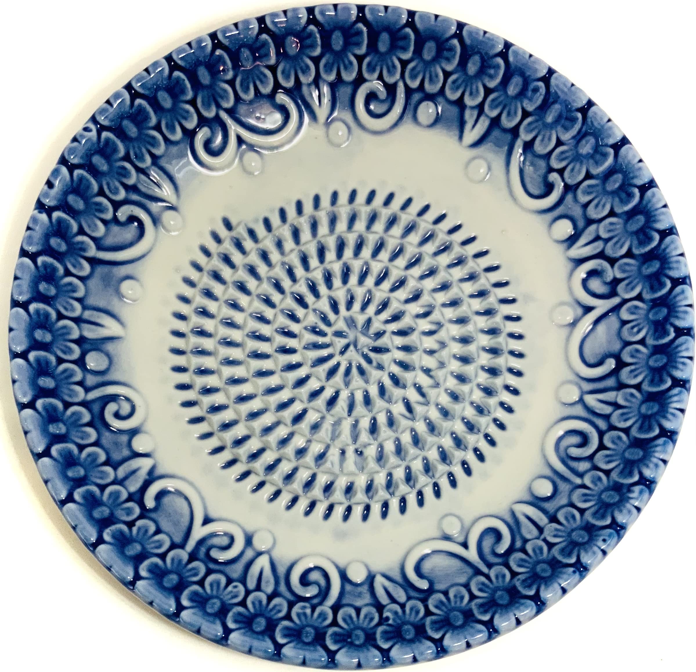 BonCera display stand showcasing the blue embossed set on the counter.