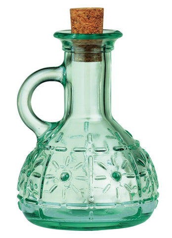 Pouring action showing smooth oil dispensing from the Olivia cruet.