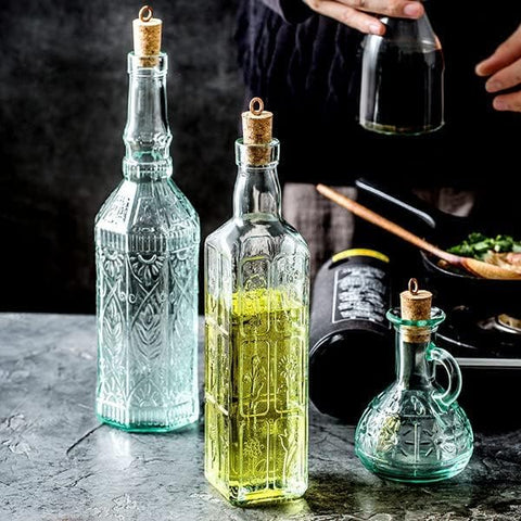 Flavored oil or vinegar served in the Olivia cruet enhances kitchen presentation.