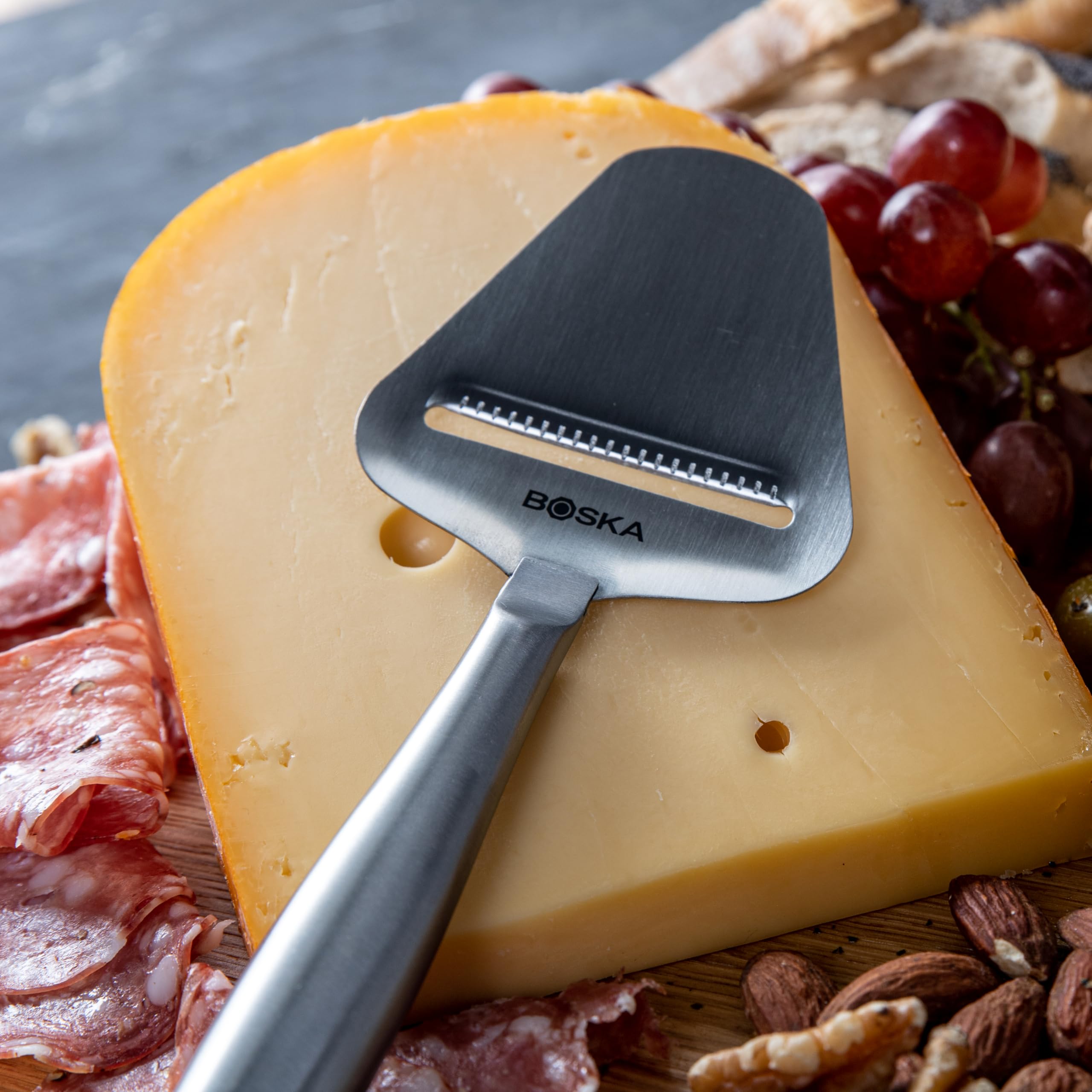 Boska Copenhagen cheese slicer in hand for easy slicing on the go