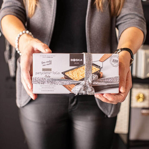 Included spatula helps lift melted cheese onto bread slices.