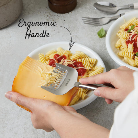 Boska grater shredding hard cheese with precise, effortless results.