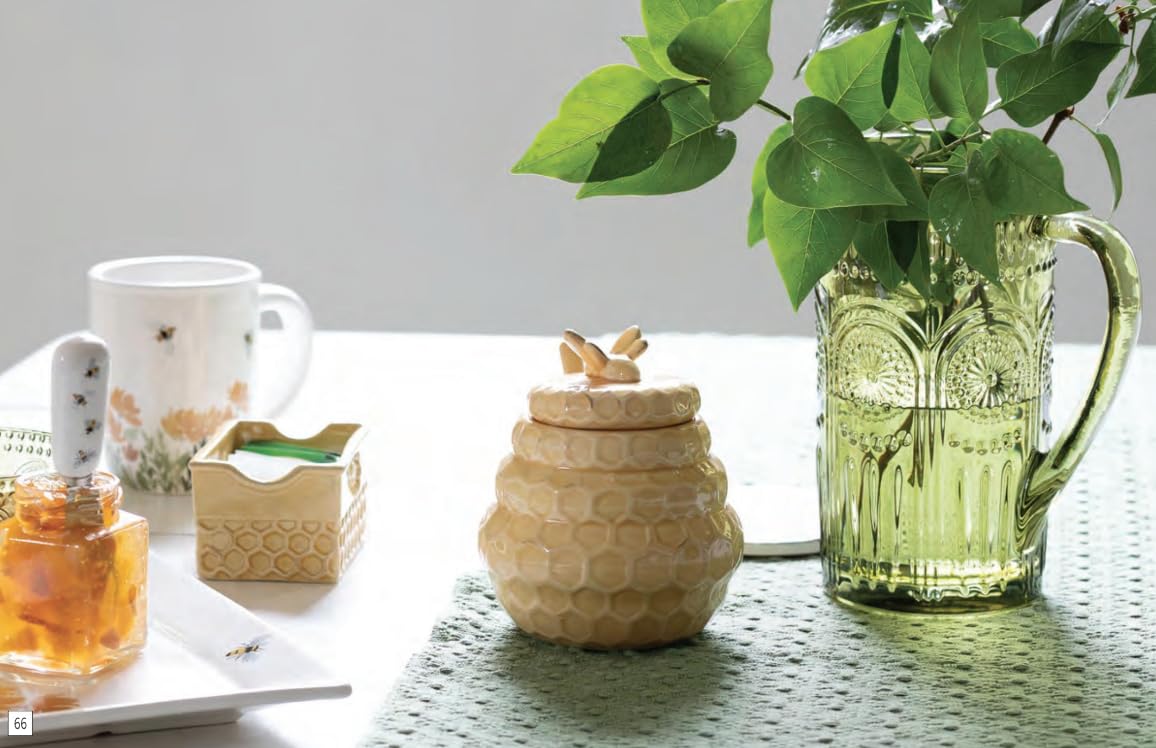 Boston International beehive honey pot with honeycomb pattern and lid for decorative table display.