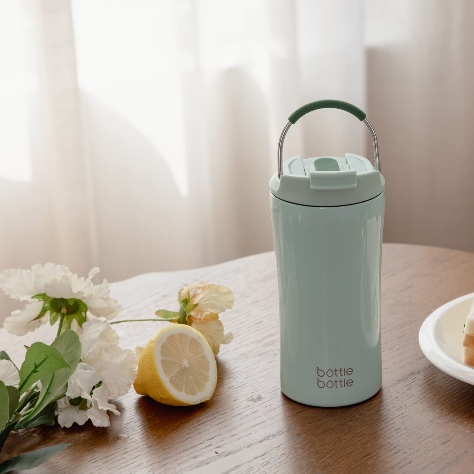 BOTTLE BOTTLE office and travel mug in green, ready for daily use.