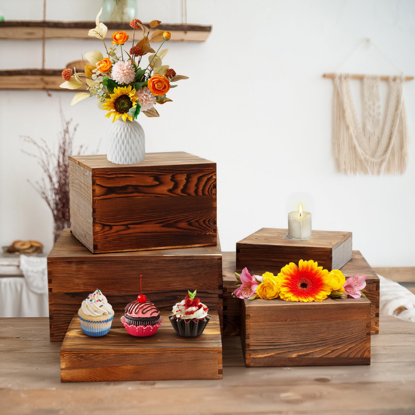 BoyMCowboy burnt-wood cake stand texture adds rustic charm to displays.