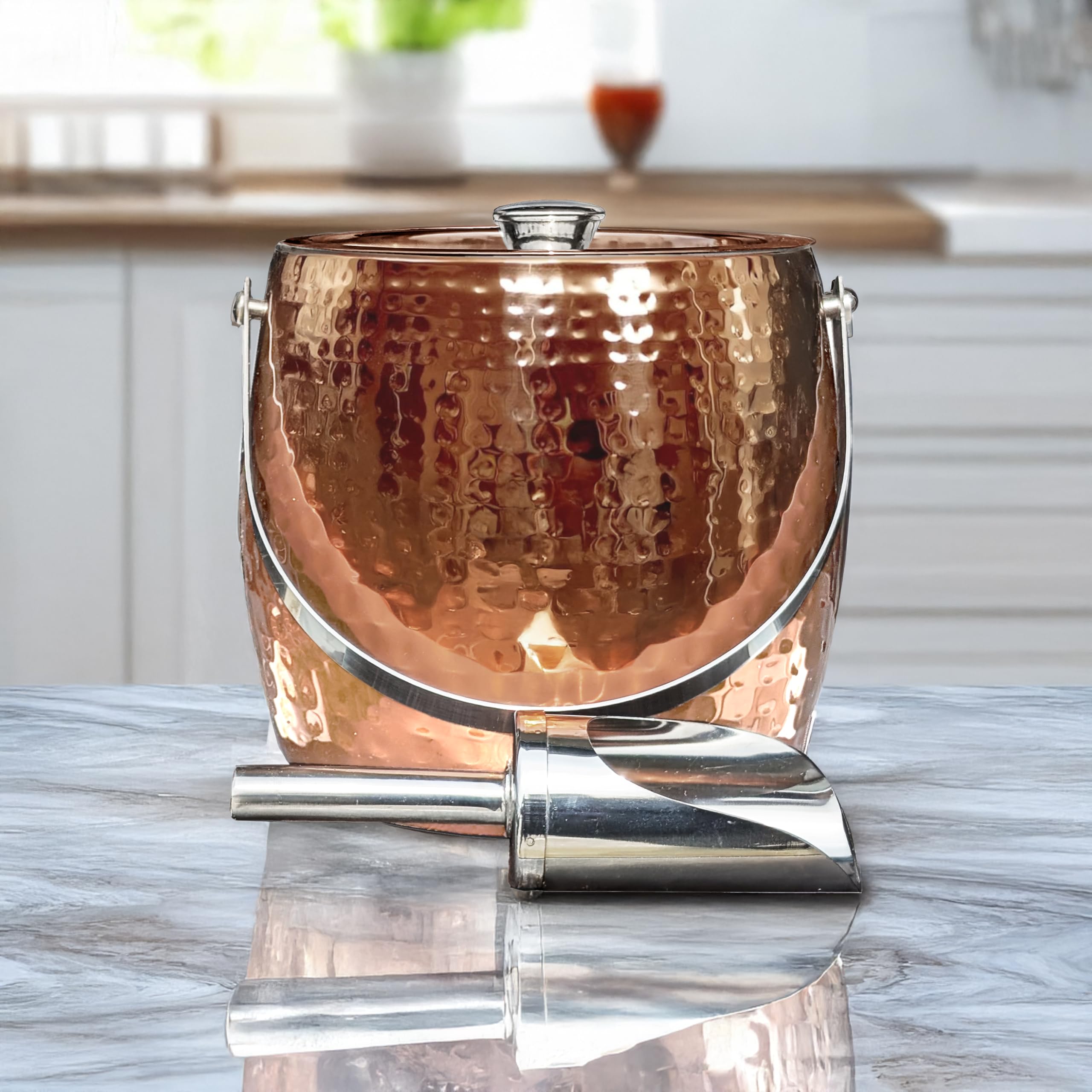 BREKX rose gold ice bucket on a home bar table setup