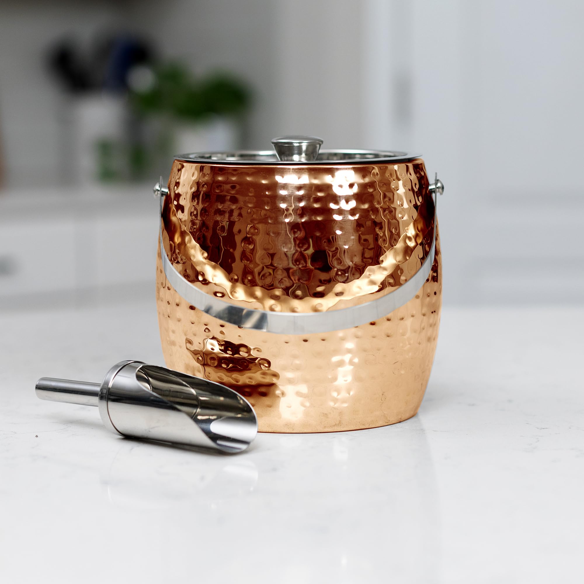 BREKX rose gold ice bucket holding wine bottle in ice