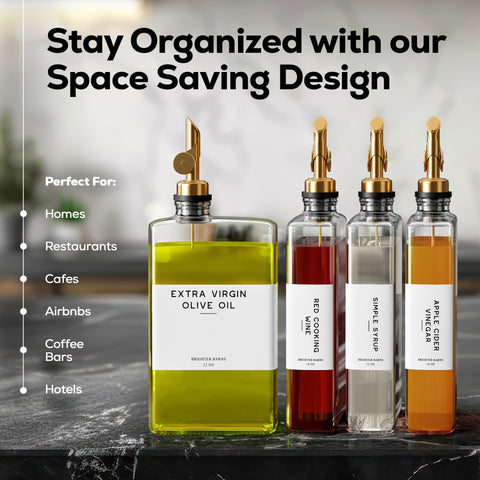 Two Brighter Barns clear glass bottles with gold spouts for drip-free pours