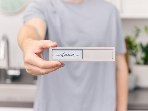 Brothers Bench dishwasher magnet with stainless steel frame enhances kitchen decor.