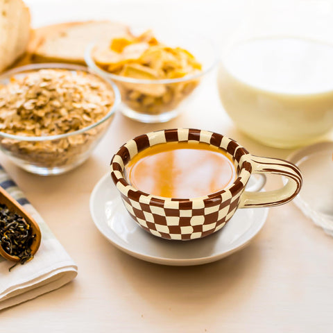 BuleVina checkered mug with coffee steam suggests cozy morning moments.