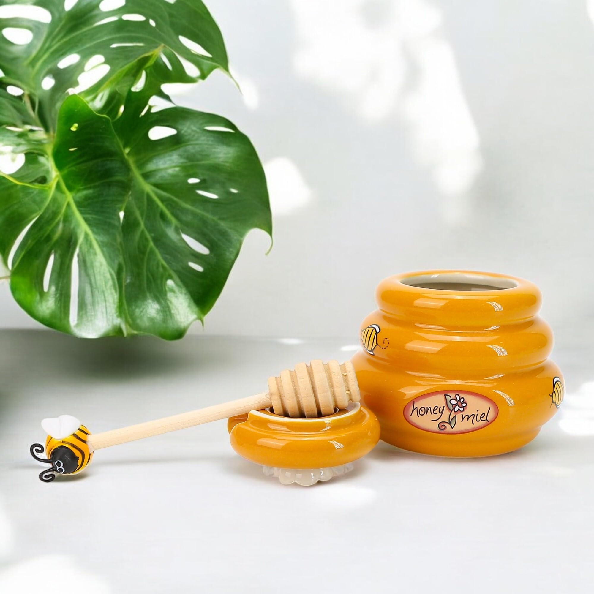BuleVina farmhouse bee-theme jar complements rustic kitchen decor.