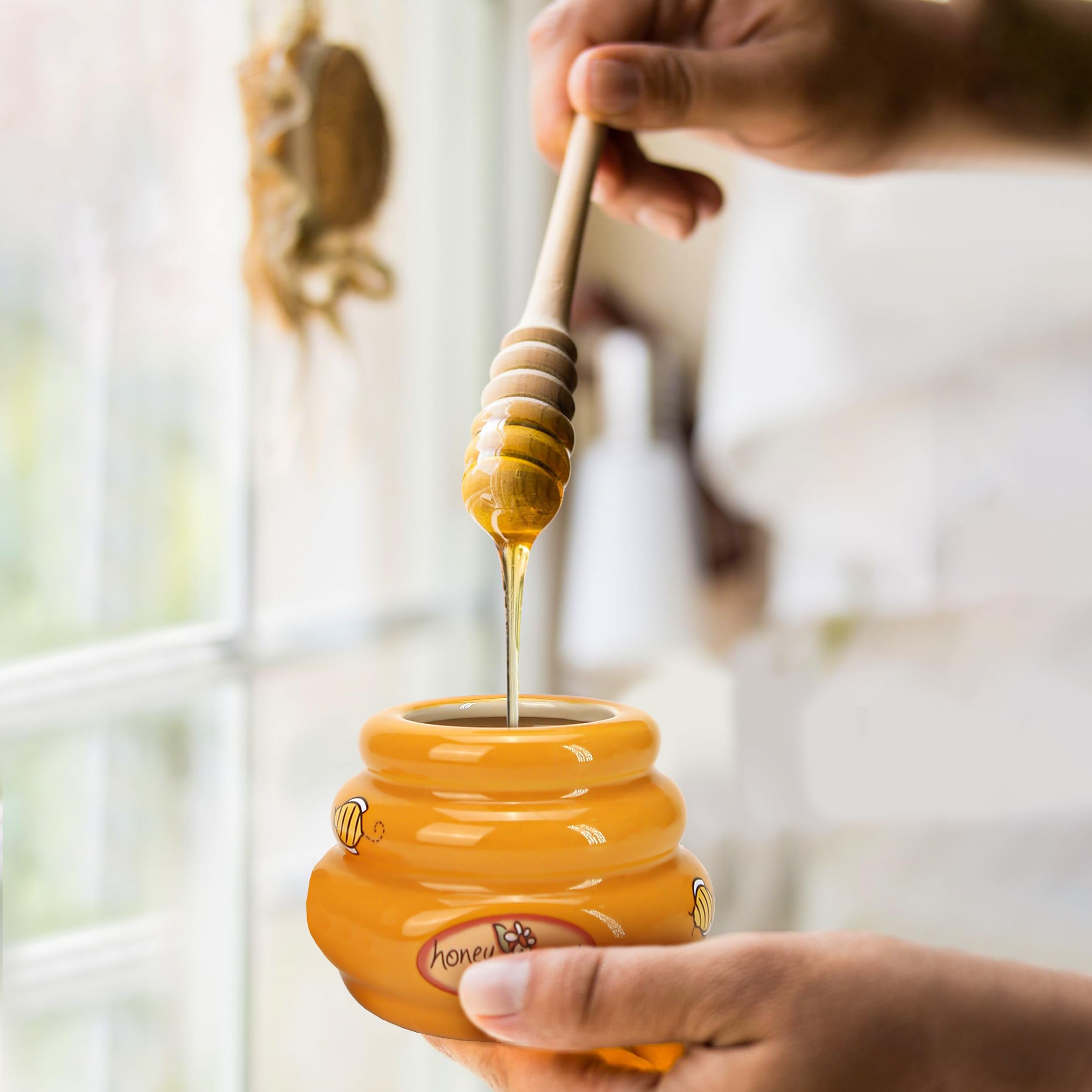 BuleVina tea-serving setup with honey pot and dipper for warm beverages.