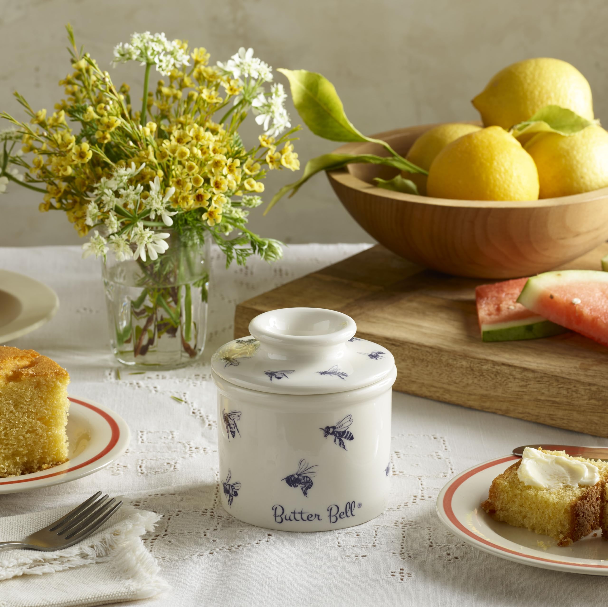 Butter Bell lid featuring honey-bee pattern adds farmhouse charm while protecting butter.