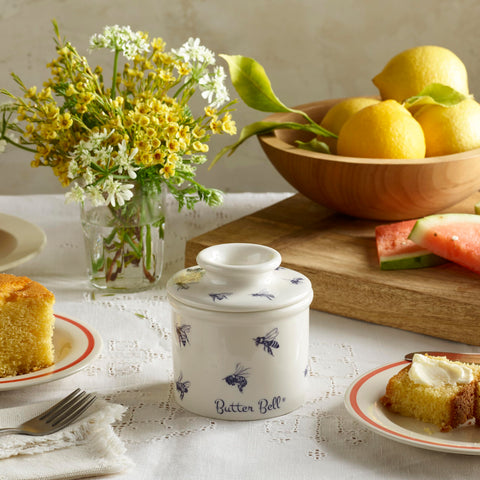 Butter Bell lid featuring honey-bee pattern adds farmhouse charm while protecting butter.