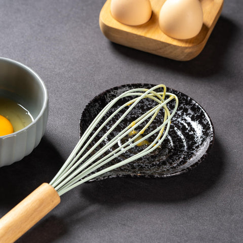 Green glazed Caigmo spoon rest emphasizes durability and style in daily use.