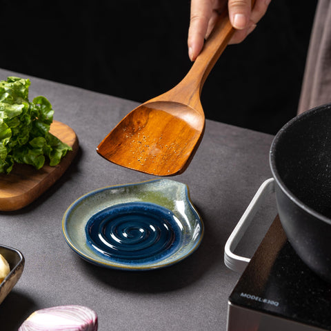Caigmo spoon rest on countertop keeps utensils within easy reach during cooking.