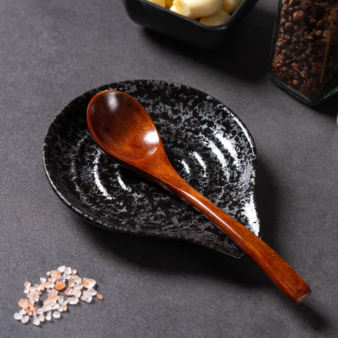 Caigmo spoon rest black top-down view heat-resistant for stovetop use.