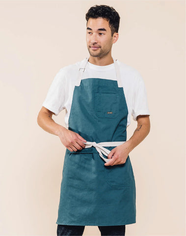 Caldo Daily Apron pockets detail shows convenient tool and towel storage