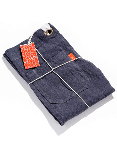 Caldo linen apron navy in use on a professional kitchen job