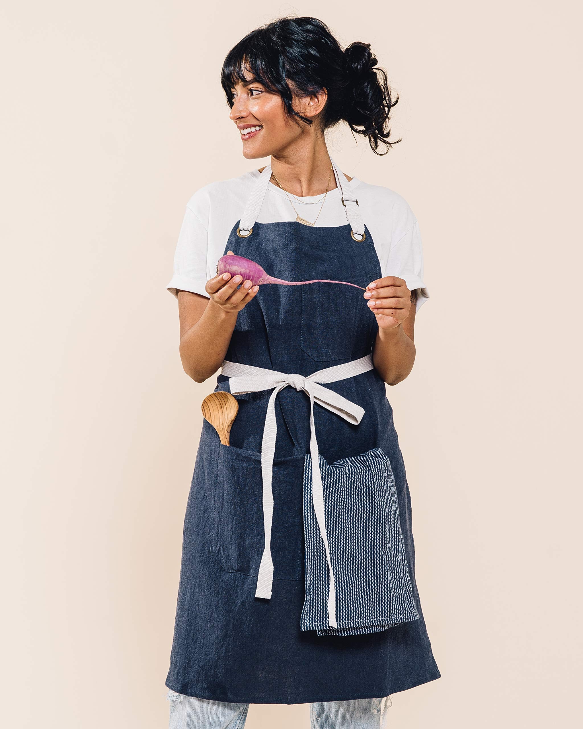 Caldo linen apron navy neck-strap adjustment demonstrates customizable fit