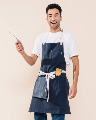 Caldo linen apron navy waist-ties illustrate flexible sizing for all body types