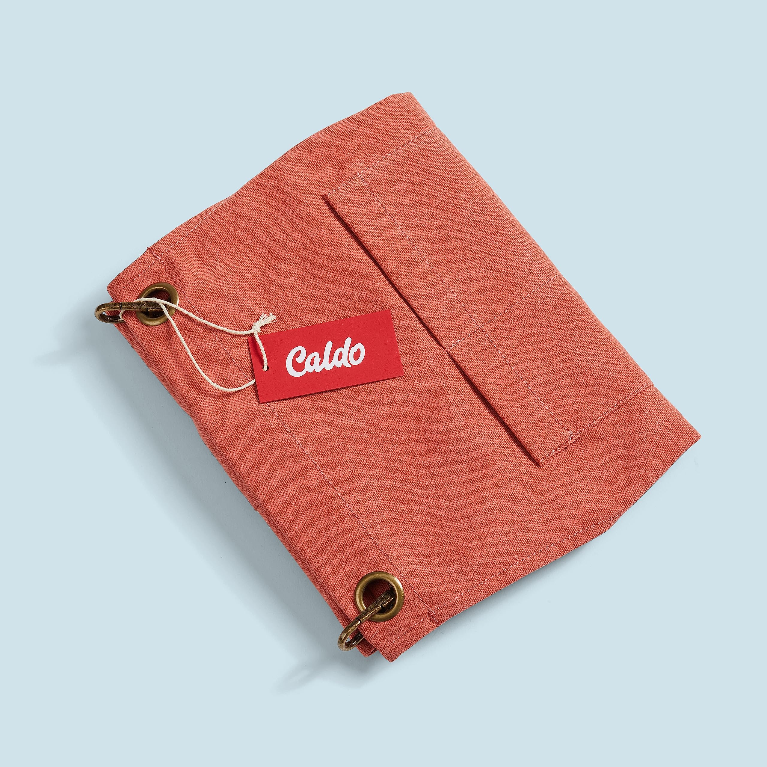 Caldo Split Leg Apron Terracotta mobility demo illustrating ease of movement at the workstation