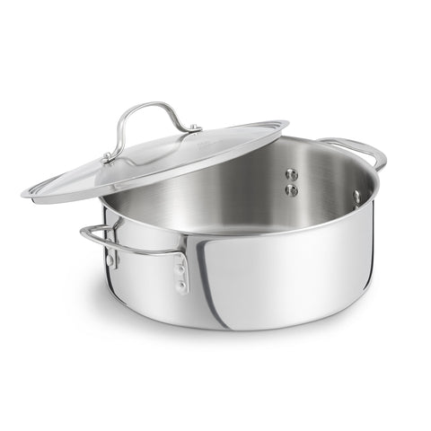 Calphalon Tri-Ply Dutch Oven with lid on for stove-to-table transfer.