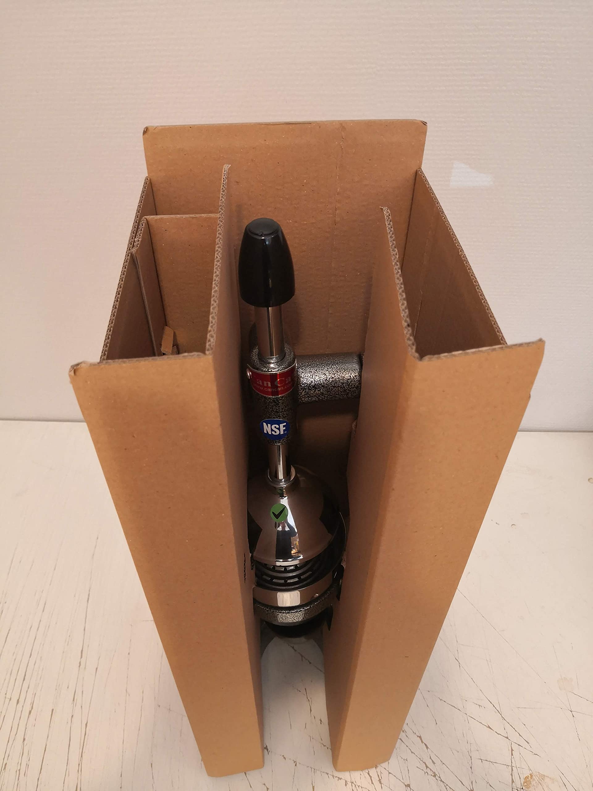 Can-Can juicer resting on rubber pads to prevent slipping.